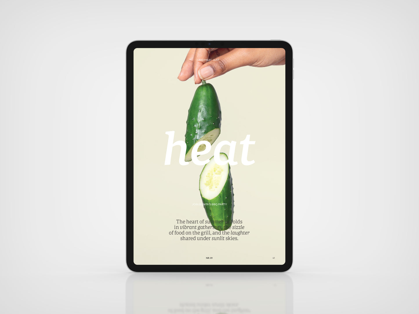 Vegan Food Magazine Digital version
Digital tablet displaying an image of a hand holding a sliced cucumber with text on a light background