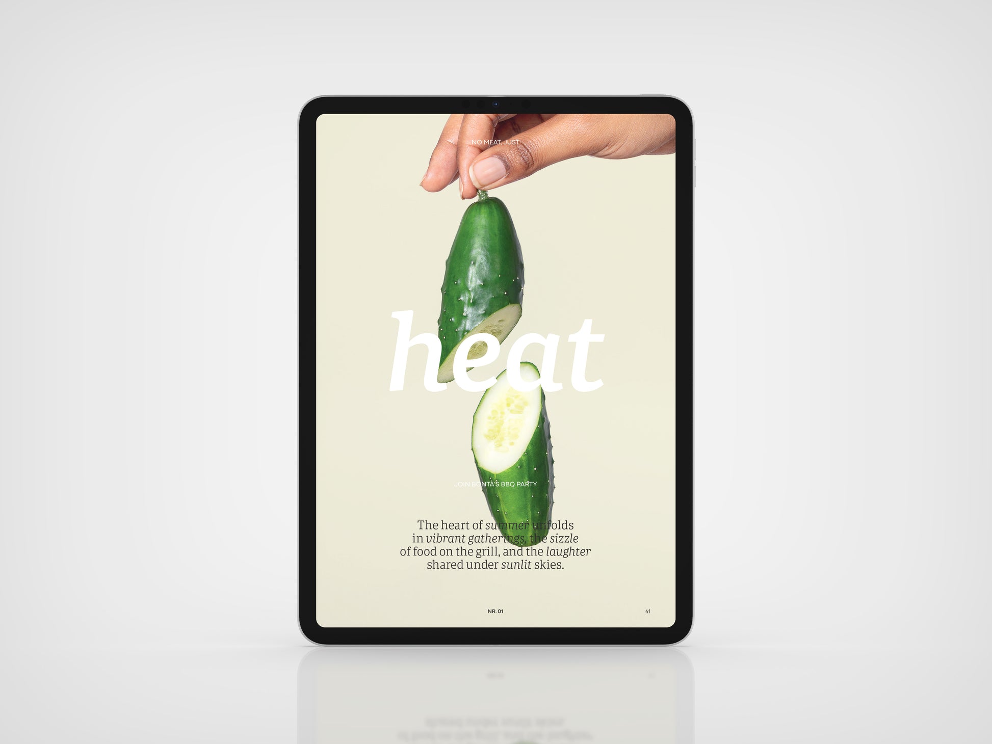 Vegan Food Magazine Digital version
Digital tablet displaying an image of a hand holding a sliced cucumber with text on a light background