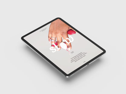 Vegan Food Magazine Digital page.
Hand holding a small white object over an open book on a tablet screen.