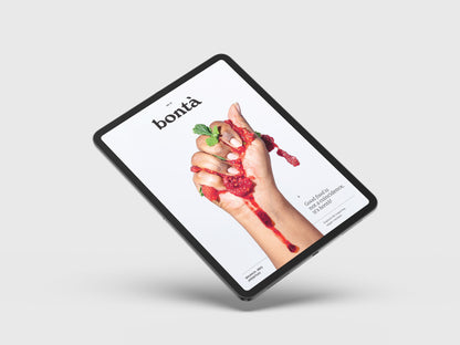 Vegan Food Magazine Digital Cover. A tablet showing the first edition of Bontà Magazine digital version on a light gray background